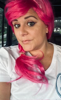 a woman with a pink hat